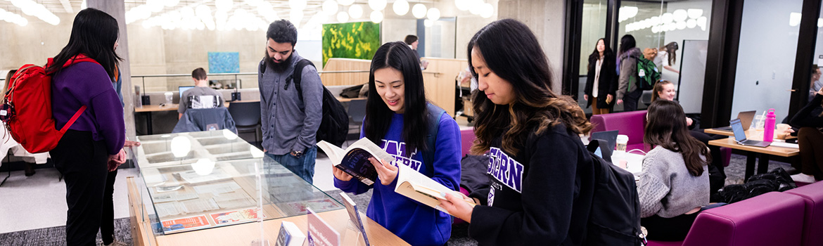 Students looking at items in a display